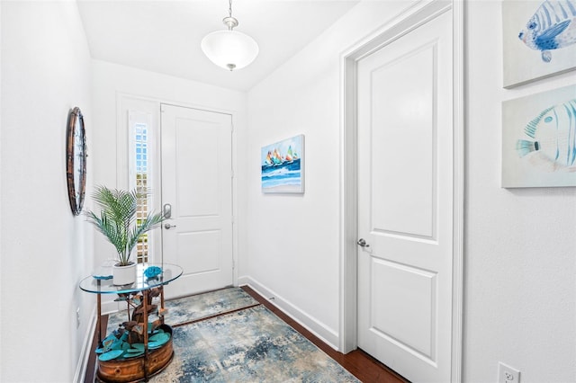 1181 Castlevecchio Loop, Orlando, FL 32825 - entrance foyer featuring dark wood-type flooring and baseboards