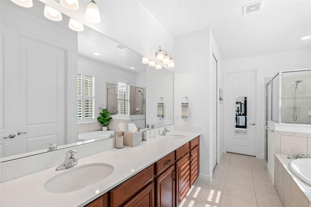 1181 Castlevecchio Loop, Orlando, FL 32825 - full bathroom featuring a garden tub, a stall shower, double vanity, tile patterned floors, and recessed lighting