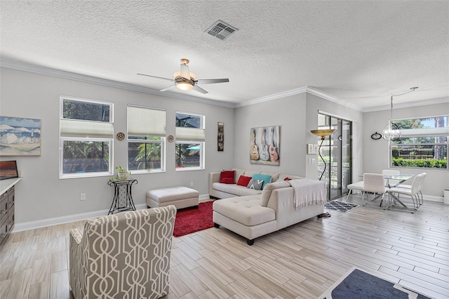 100 Verde Way, Debary, FL 32713 - living room with light wood-type flooring, a ceiling fan, ornamental molding, a chandelier, and a textured ceiling