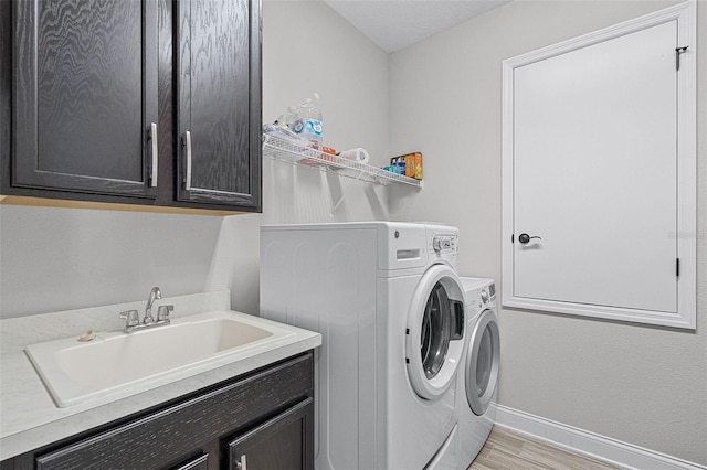 100 Verde Way, Debary, FL 32713 - washroom featuring cabinet space, independent washer and dryer, and light wood-style flooring