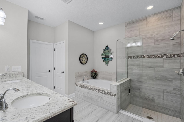 100 Verde Way, Debary, FL 32713 - full bath with a garden tub, tiled shower, double vanity, recessed lighting, and tile patterned flooring