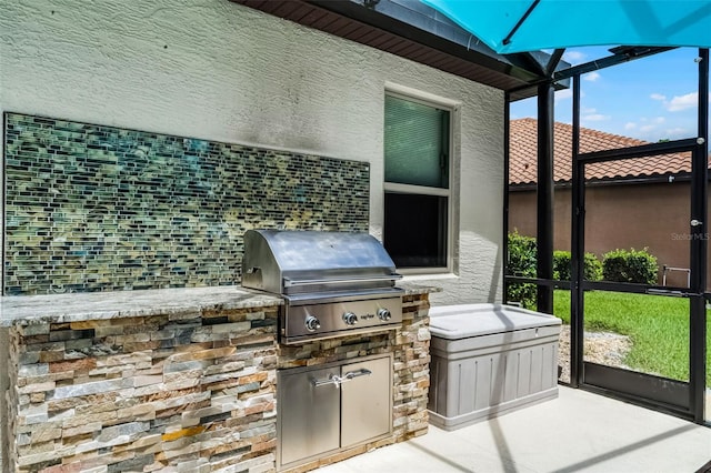 100 Verde Way, Debary, FL 32713 - view of patio / terrace featuring exterior kitchen and glass enclosure