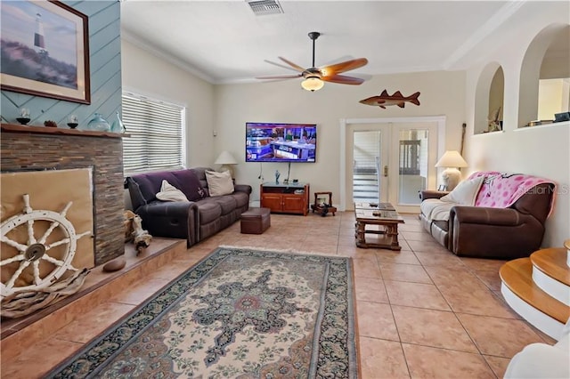 12350 83rd St, Fellsmere, FL 32948 - living area featuring plenty of natural light, a ceiling fan, light tile patterned flooring, ornamental molding, and french doors
