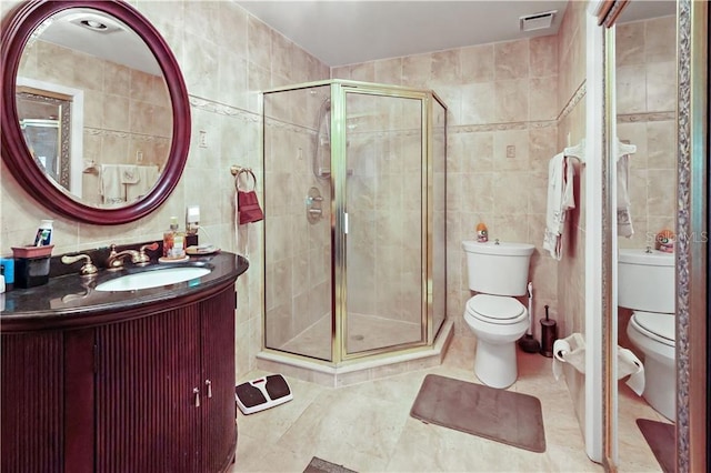 12350 83rd St, Fellsmere, FL 32948 - bathroom featuring tile walls, a shower stall, vanity, and tile patterned floors