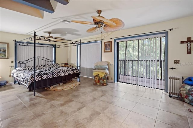 12350 83rd St, Fellsmere, FL 32948 - bedroom featuring radiator heating unit, tile patterned flooring, and access to exterior