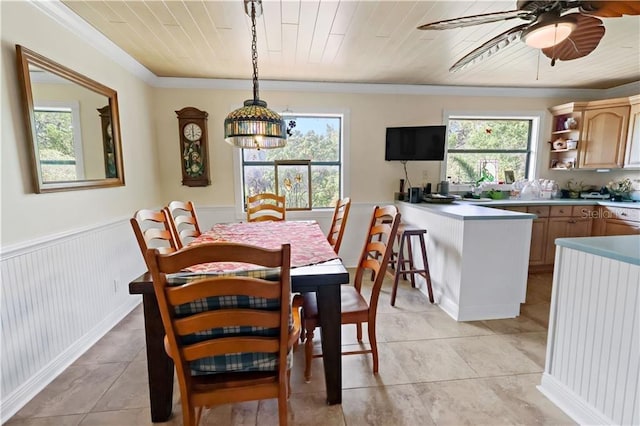 12350 83rd St, Fellsmere, FL 32948 - dining area with healthy amount of natural light, a ceiling fan, light tile patterned flooring, a wainscoted wall, and wood ceiling