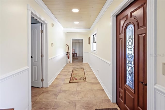 12350 83rd St, Fellsmere, FL 32948 - hallway with ornamental molding and light tile patterned flooring