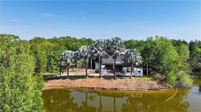 12350 83rd St, Fellsmere, FL 32948 - rear view of property with a water view and a garage