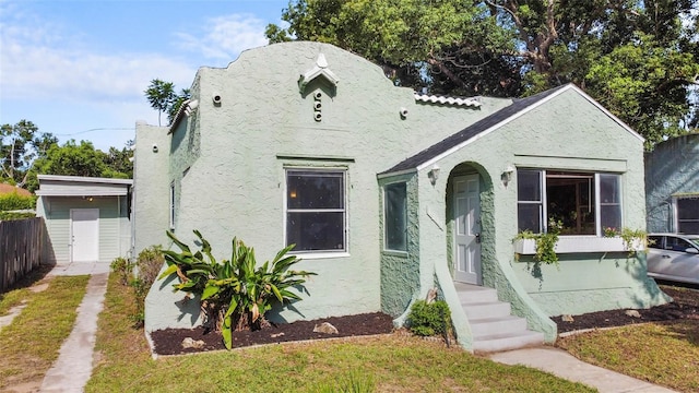 1215 6th St, Clermont, FL 34711 - view of front facade featuring stucco siding and entry steps