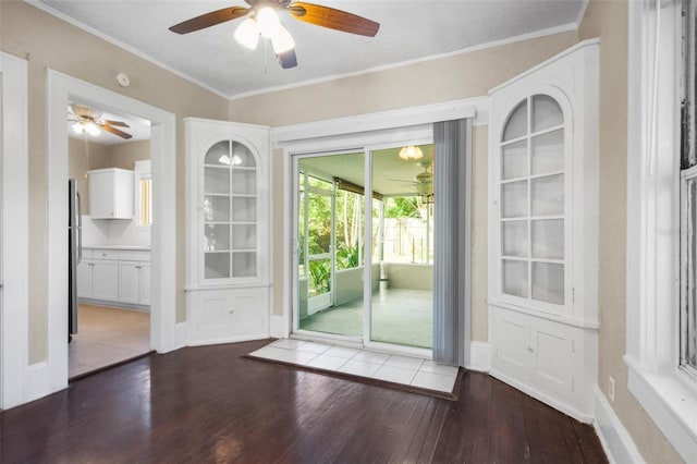 1215 6th St, Clermont, FL 34711 - unfurnished dining area with a ceiling fan, wood-type flooring, and ornamental molding