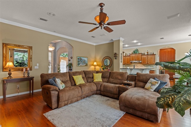 11613 Swift Water Cir, Orlando, FL 32817 - living area featuring arched walkways, wood-type flooring, ceiling fan, ornamental molding, and recessed lighting