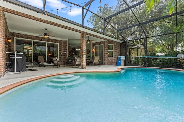 11613 Swift Water Cir, Orlando, FL 32817 - outdoor pool with a ceiling fan, a patio area, area for grilling, and a lanai