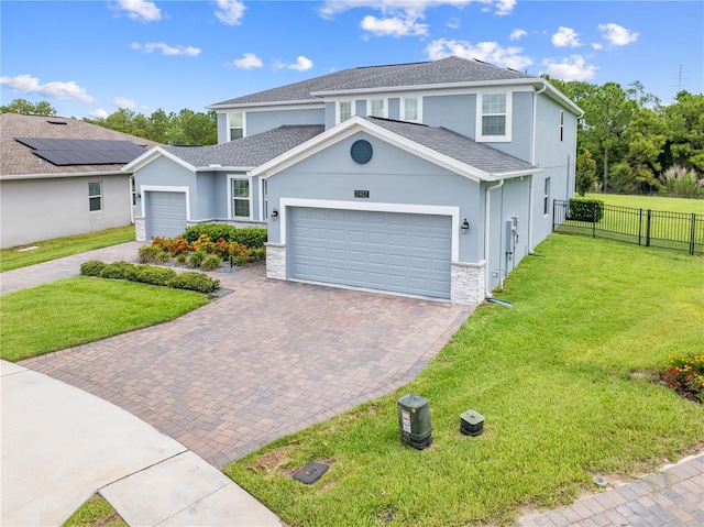 2412 Camden Park Ave, Davenport, FL 33837 - traditional home featuring a garage, decorative driveway, stucco siding, and a shingled roof
