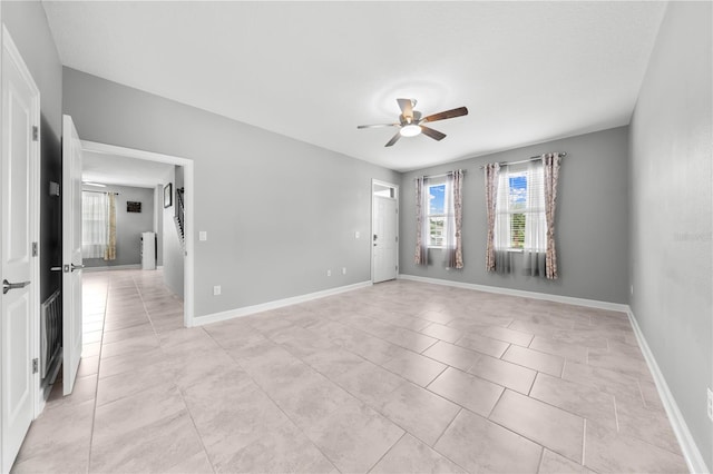 2412 Camden Park Ave, Davenport, FL 33837 - empty room featuring ceiling fan and light tile patterned flooring