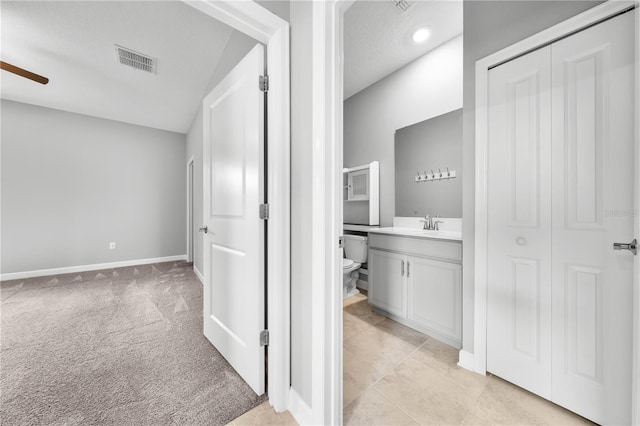 2412 Camden Park Ave, Davenport, FL 33837 - bathroom featuring a ceiling fan, vanity, and a closet