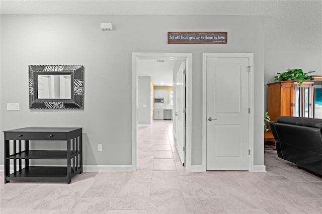 2412 Camden Park Ave, Davenport, FL 33837 - corridor with baseboards and light tile patterned floors