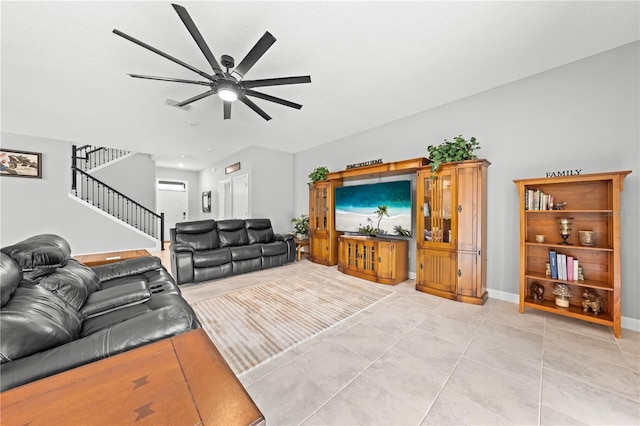 2412 Camden Park Ave, Davenport, FL 33837 - living area featuring a ceiling fan, stairs, and light tile patterned flooring