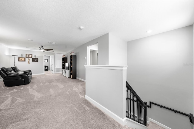 2412 Camden Park Ave, Davenport, FL 33837 - corridor with an upstairs landing, light carpet, and a textured ceiling