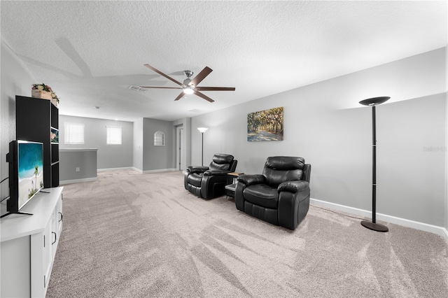2412 Camden Park Ave, Davenport, FL 33837 - sitting room featuring ceiling fan, light colored carpet, and a textured ceiling