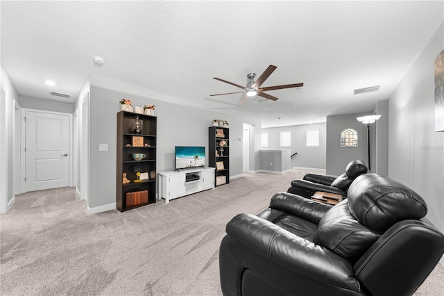 2412 Camden Park Ave, Davenport, FL 33837 - living room featuring a ceiling fan and light colored carpet