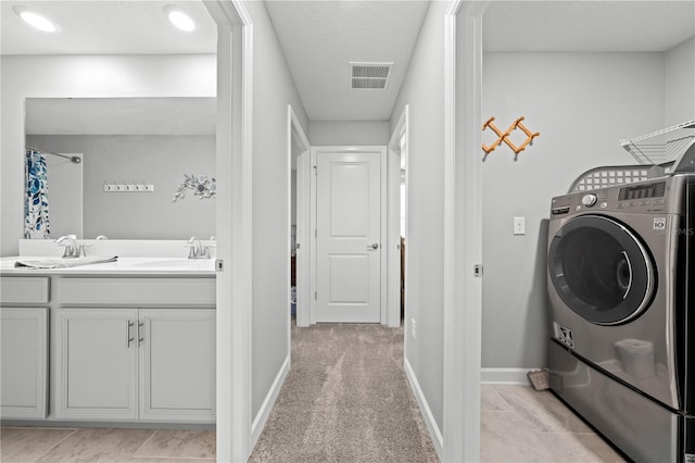 2412 Camden Park Ave, Davenport, FL 33837 - washroom with washer / clothes dryer and a textured ceiling
