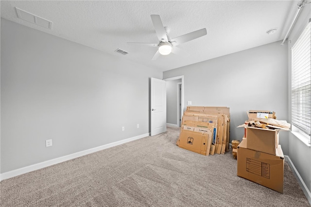 2412 Camden Park Ave, Davenport, FL 33837 - bedroom featuring a textured ceiling, carpet, and a ceiling fan