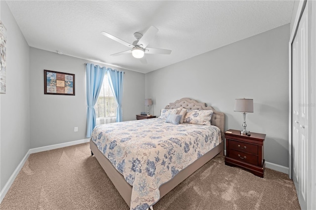 2412 Camden Park Ave, Davenport, FL 33837 - carpeted bedroom with a closet, a textured ceiling, and ceiling fan