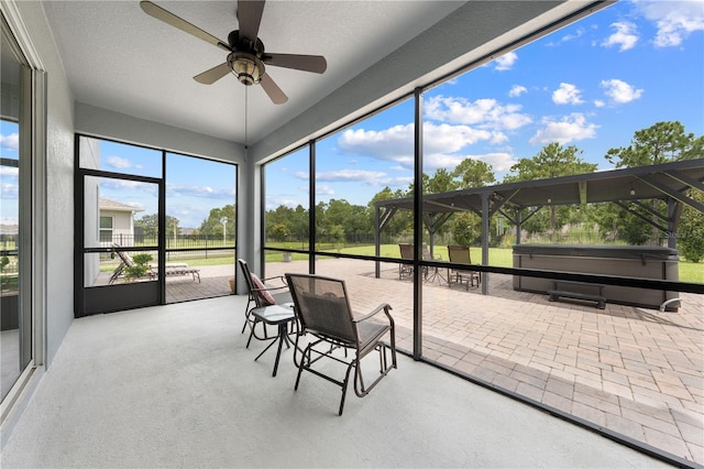 2412 Camden Park Ave, Davenport, FL 33837 - sunroom featuring a ceiling fan and a jacuzzi