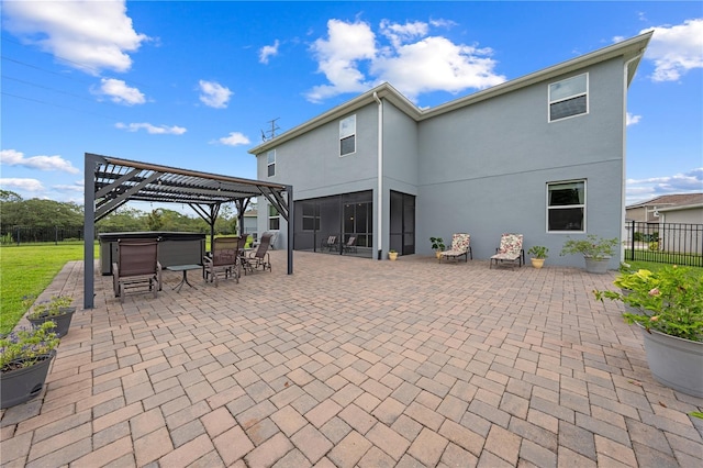 2412 Camden Park Ave, Davenport, FL 33837 - back of house with a pergola, a patio, a hot tub, and stucco siding