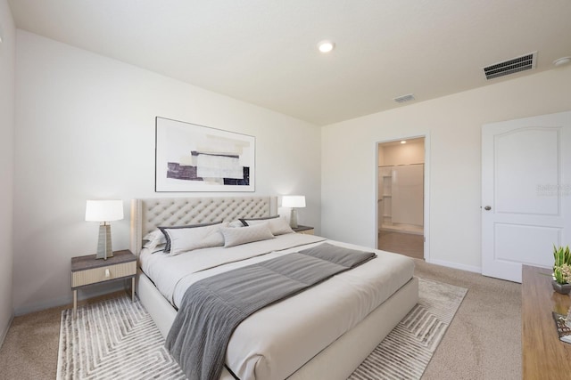 3241 Silas Dr, New Smyrna Beach, FL 32168 - bedroom with light colored carpet, recessed lighting, and ensuite bathroom