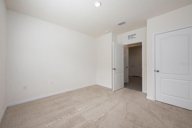 3241 Silas Dr, New Smyrna Beach, FL 32168 - unfurnished bedroom featuring light carpet