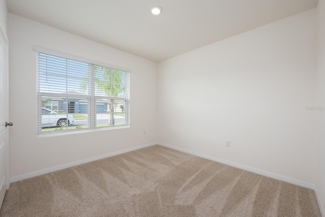3241 Silas Dr, New Smyrna Beach, FL 32168 - carpeted empty room featuring baseboards and recessed lighting
