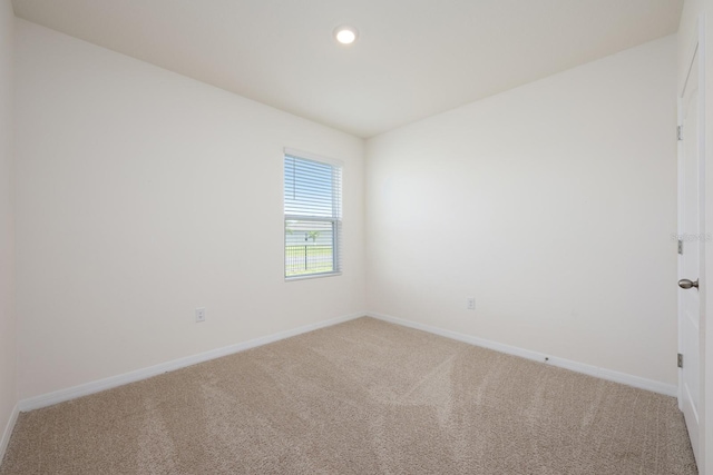 3241 Silas Dr, New Smyrna Beach, FL 32168 - spare room with light colored carpet and recessed lighting
