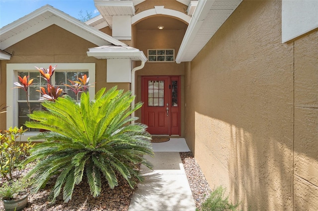 1048 Woodsong Way, Clermont, FL 34714 - property entrance featuring stucco siding