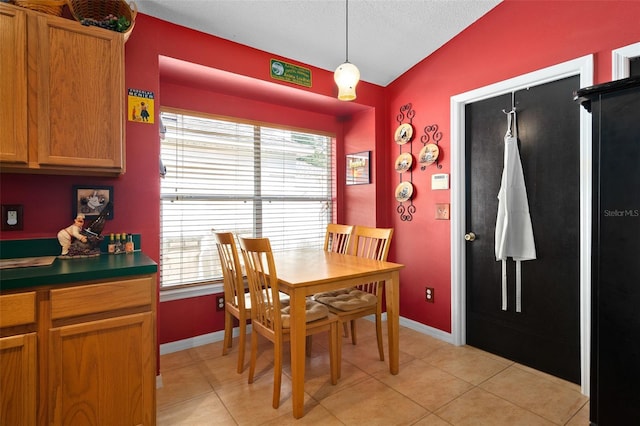 1048 Woodsong Way, Clermont, FL 34714 - dining area with light tile patterned floors and vaulted ceiling