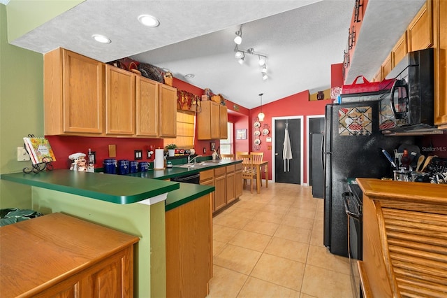 1048 Woodsong Way, Clermont, FL 34714 - kitchen featuring black microwave, vaulted ceiling, a peninsula, light tile patterned flooring, and dishwasher