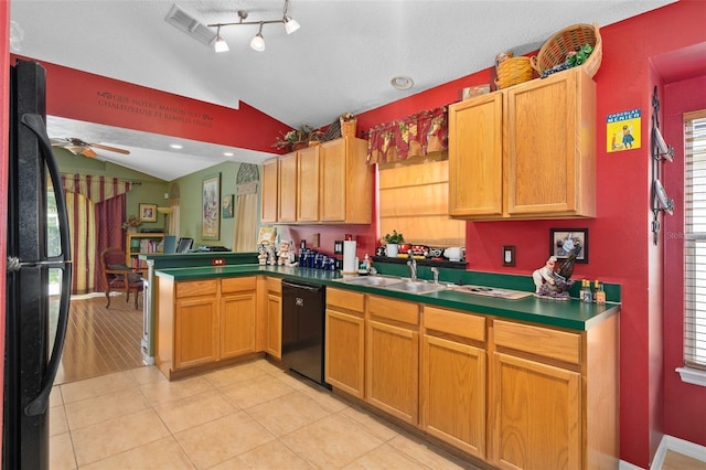 1048 Woodsong Way, Clermont, FL 34714 - kitchen featuring black appliances, lofted ceiling, a peninsula, ceiling fan, and light tile patterned floors