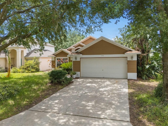 1048 Woodsong Way, Clermont, FL 34714 - view of front of house with stucco siding, concrete driveway, an attached garage, and a front lawn