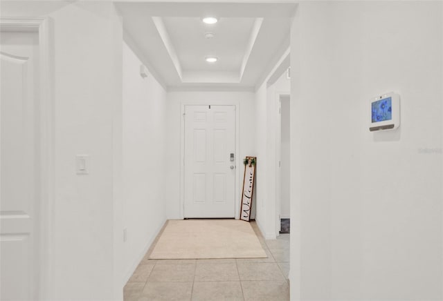 554 Pawnee Ct, Haines City, FL 33844 - hall featuring a raised ceiling, light tile patterned floors, and recessed lighting