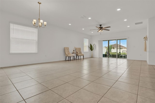 554 Pawnee Ct, Haines City, FL 33844 - unfurnished room featuring recessed lighting, light tile patterned flooring, a chandelier, and a ceiling fan
