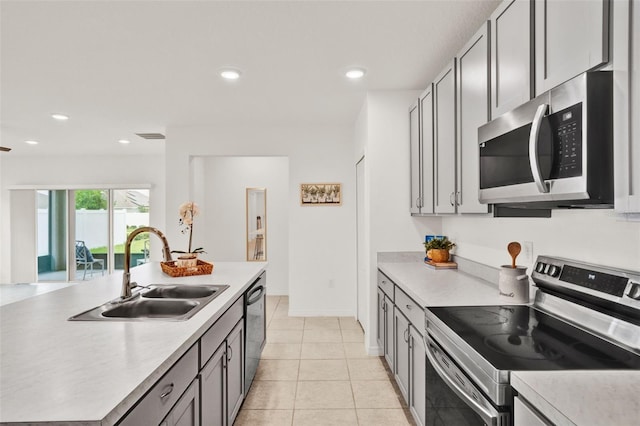 554 Pawnee Ct, Haines City, FL 33844 - kitchen featuring appliances with stainless steel finishes, light countertops, recessed lighting, and light tile patterned flooring