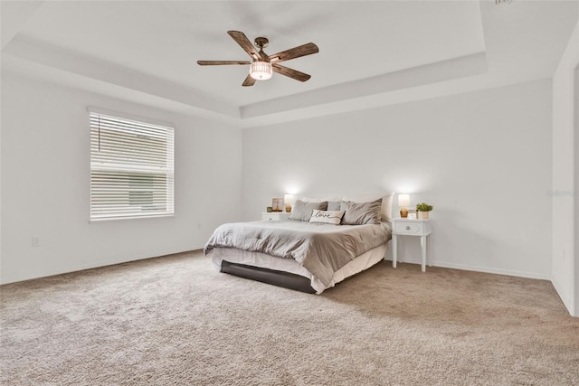 554 Pawnee Ct, Haines City, FL 33844 - carpeted bedroom with a raised ceiling and a ceiling fan