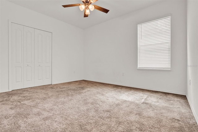 554 Pawnee Ct, Haines City, FL 33844 - unfurnished bedroom featuring carpet, a closet, and a ceiling fan