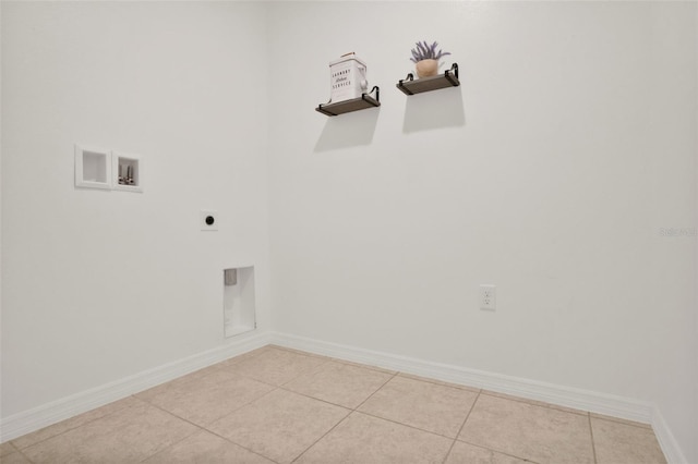 554 Pawnee Ct, Haines City, FL 33844 - washroom featuring hookup for an electric dryer, hookup for a washing machine, and tile patterned floors