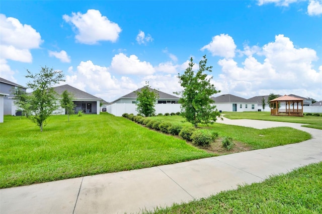 554 Pawnee Ct, Haines City, FL 33844 - view of front of property with a gazebo, a front lawn, and a residential view