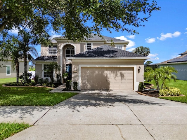 594 Hernando Pl, Clermont, FL 34715 - traditional home with a garage, stucco siding, a front yard, and driveway