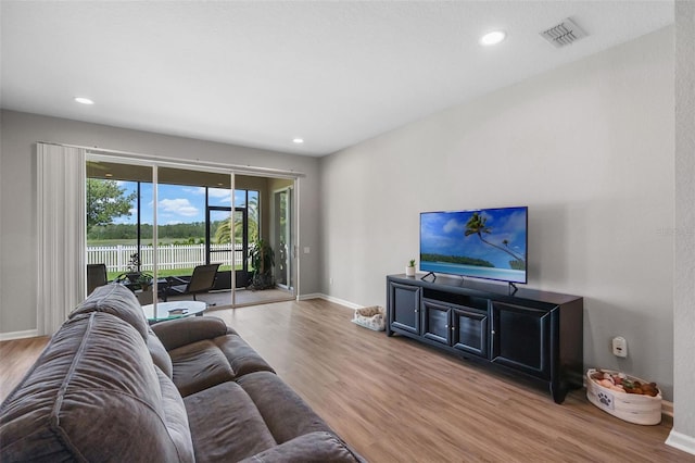 594 Hernando Pl, Clermont, FL 34715 - living room with wood finished floors and recessed lighting