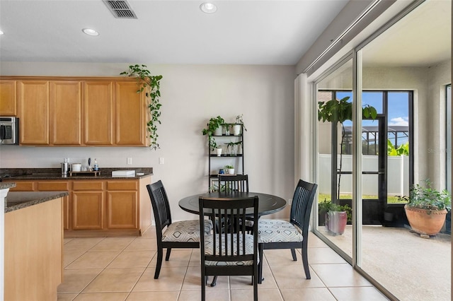 594 Hernando Pl, Clermont, FL 34715 - dining area with recessed lighting and light tile patterned flooring
