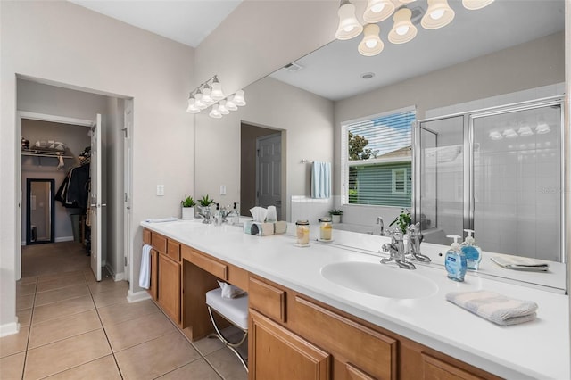 594 Hernando Pl, Clermont, FL 34715 - full bath featuring a shower stall, double vanity, tile patterned floors, a spacious closet, and a bath