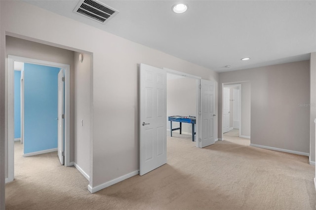 594 Hernando Pl, Clermont, FL 34715 - unfurnished bedroom with light colored carpet and recessed lighting